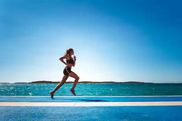 Woman running showing strong leg muscle Chipping Norton